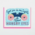 Hungry Eyes Love Card: A greeting card with an image of binoculars with donuts for eyes and the words "I got you in my sights with these HUNGRY EYES"