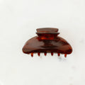 Brown hair clip on a white background