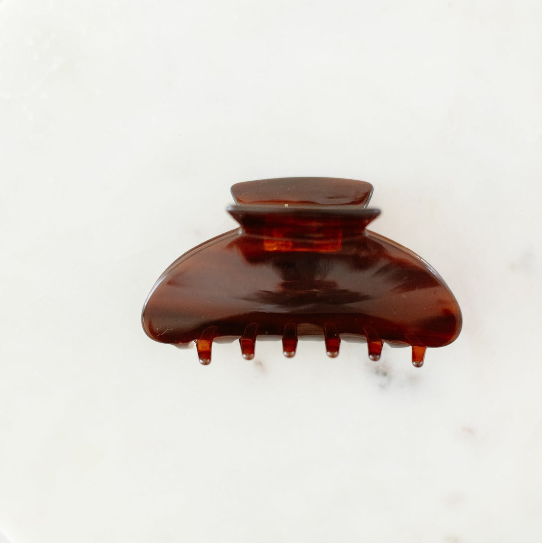 Brown hair clip on a white background