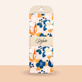 Packaging of Goldfleck reusable beeswax food wrap with floral design on a beige background