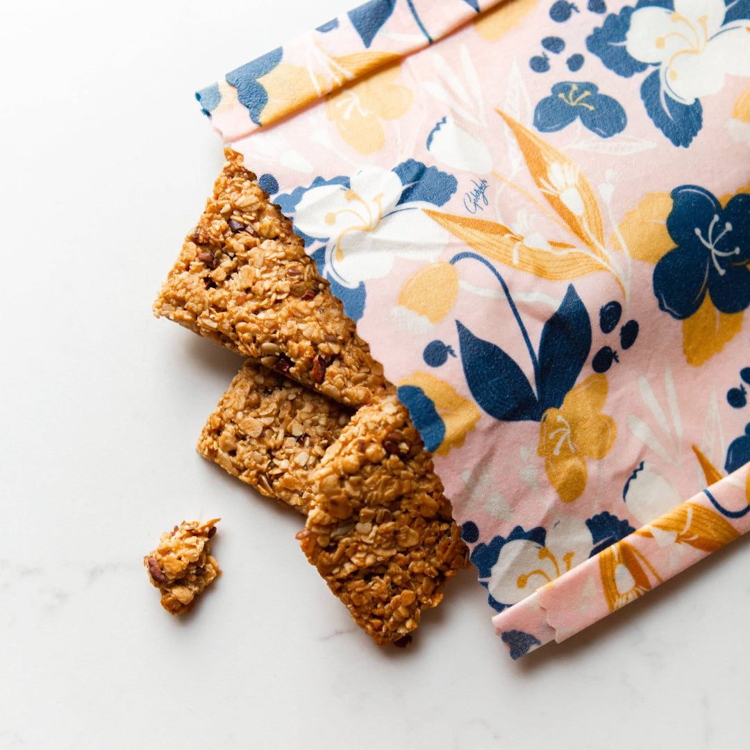 Floral-patterned fabric with crackers on a white surface