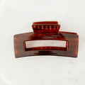 Brown hair clip on a white background