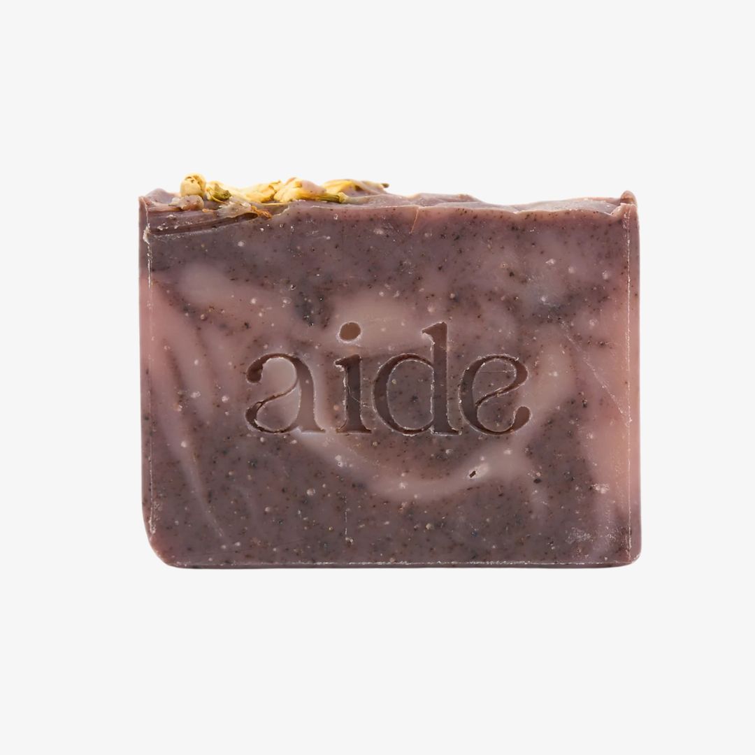 Bar of soap with 'aide' branding on a white background