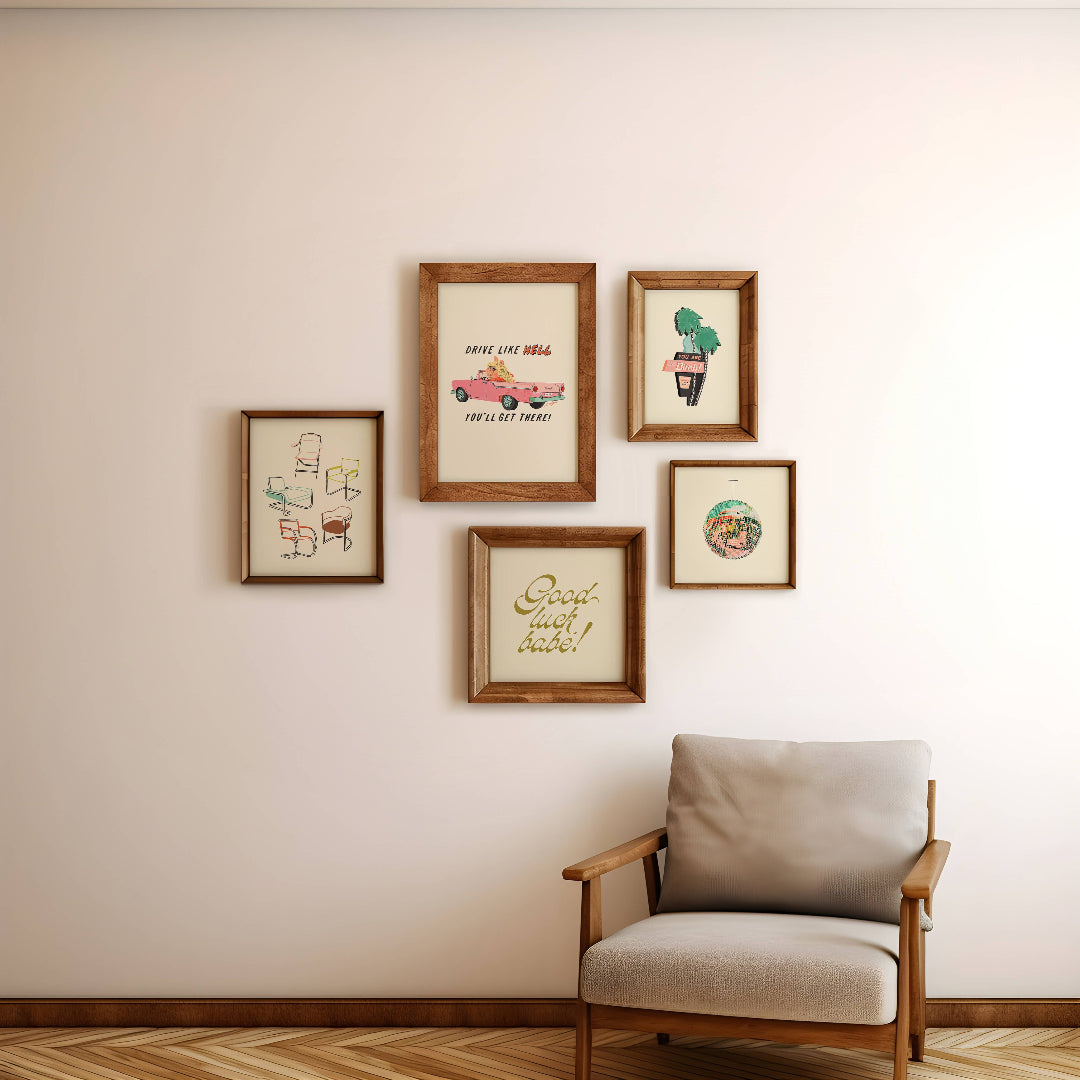 Framed artwork on a wall with a chair in front