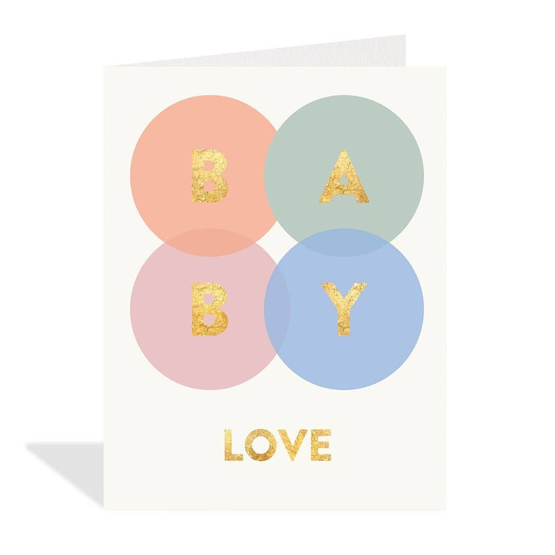 Greeting card with pastel colored circles and gold text spelling 'BABY LOVE' on a white background.