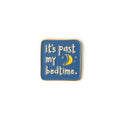 Enamel pin with 'it's past my bedtime' text and moon symbol on a blue background