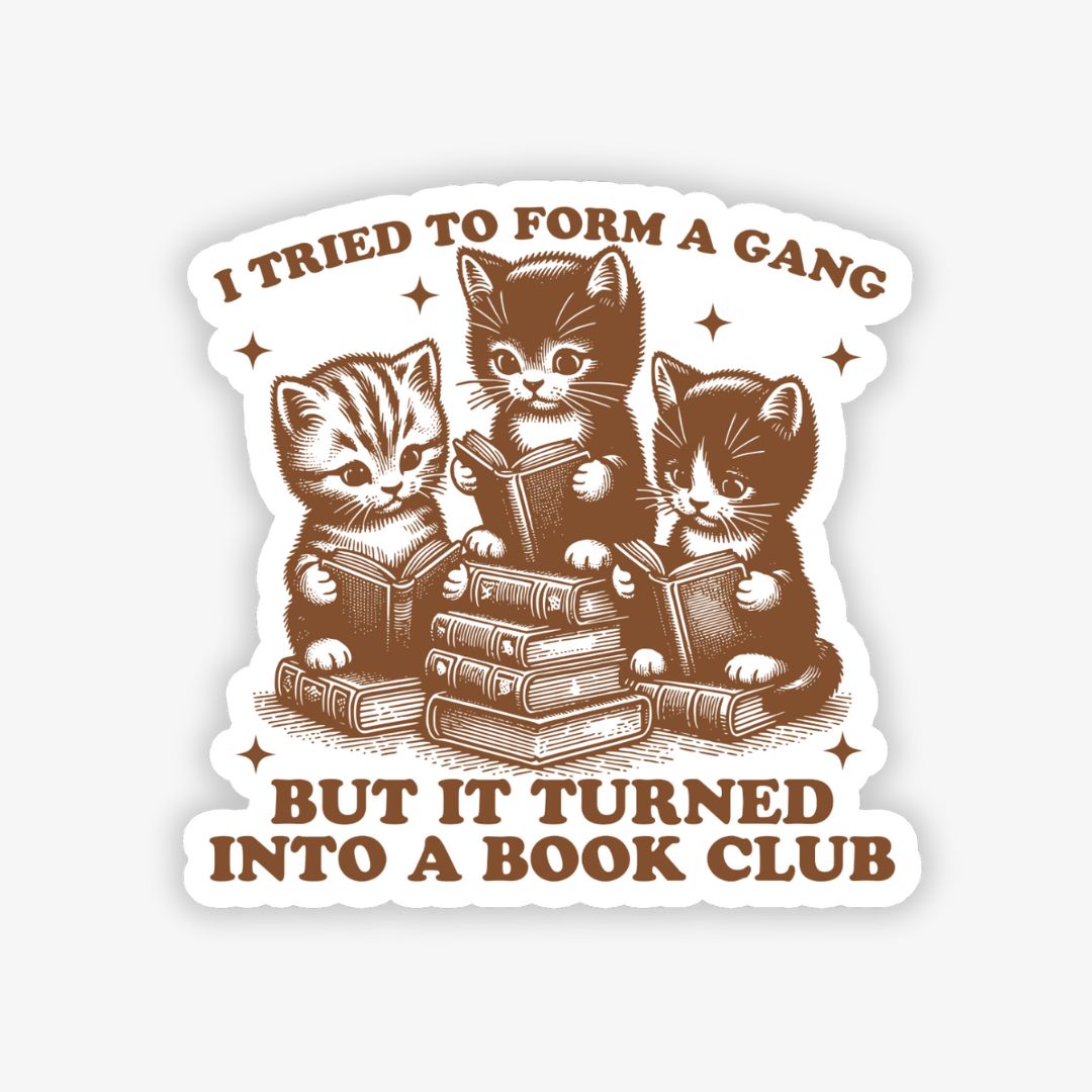 Sticker with three cats reading books and text 'I tried to form a gang but it turned into a book club' on a white background.