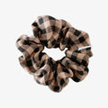 Plaid patterned scrunchie on a white background