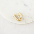 Golden hair clip on a white background