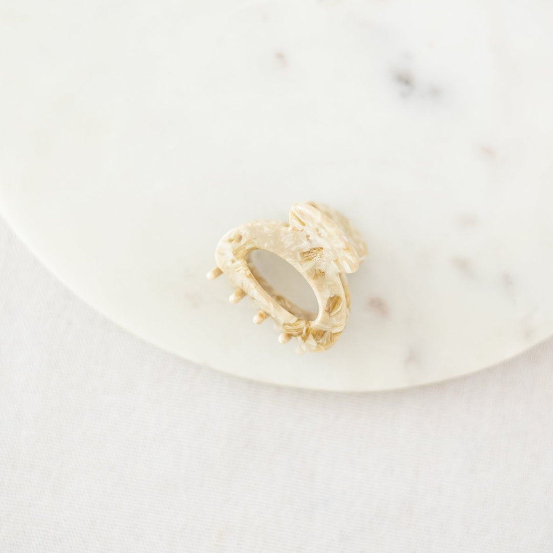 Golden hair clip on a white background