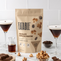 Eatable Chocolate Espresso Martini popcorn package with glasses of espresso and chocolate bars on a white background