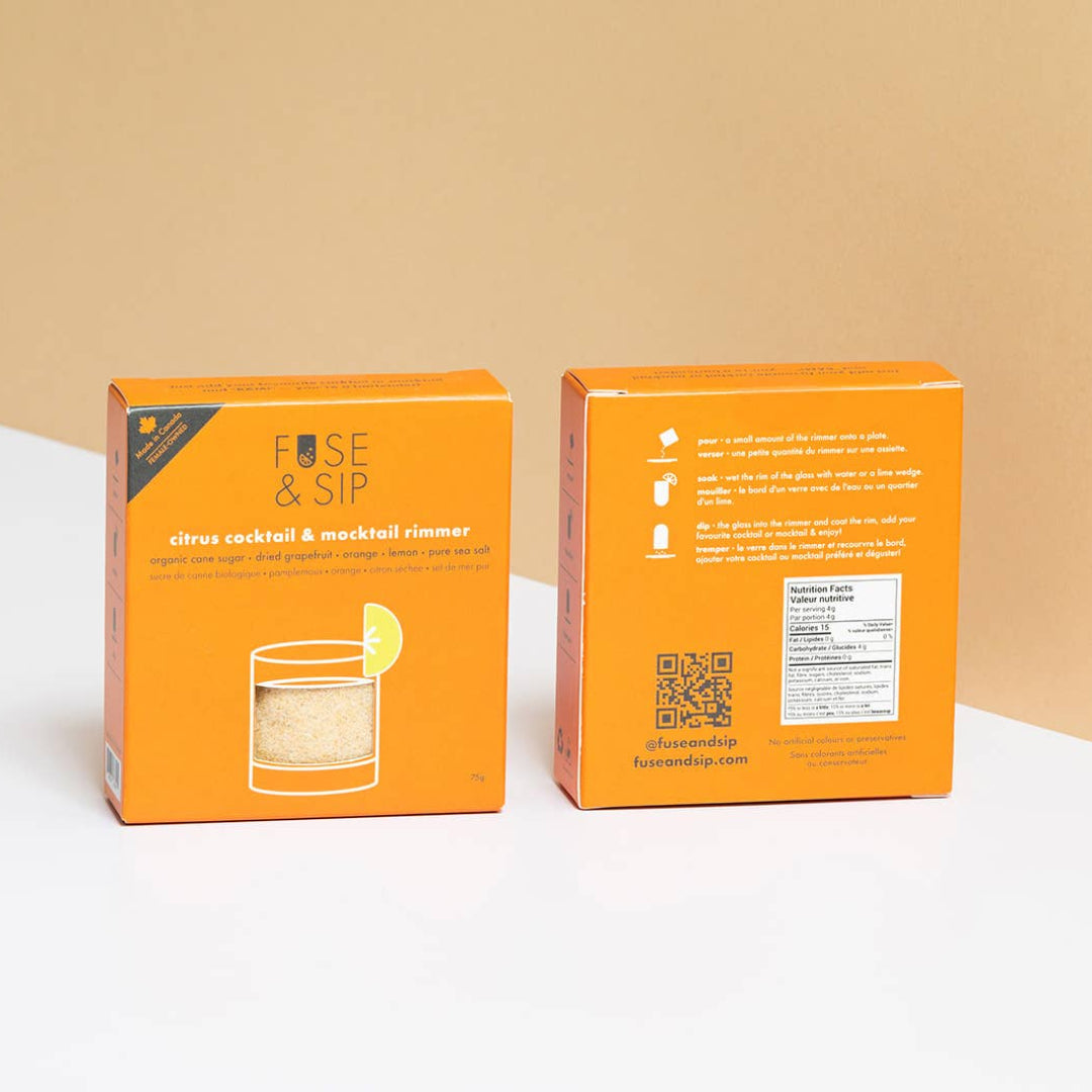 Two orange boxes with branding and product details on a beige background