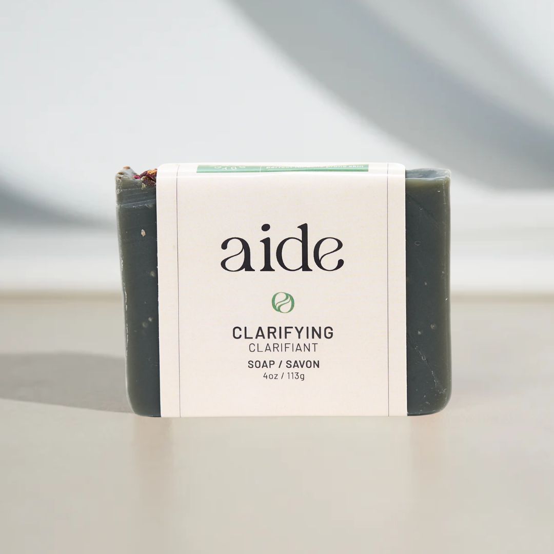 Bar of soap with 'aide' branding on a neutral background