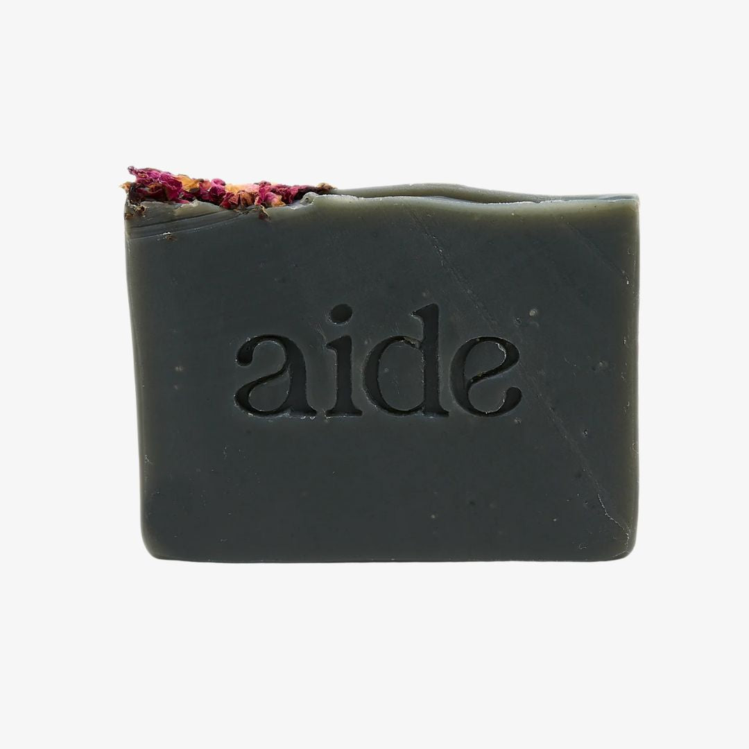Bar of soap with 'aide' branding on a white background