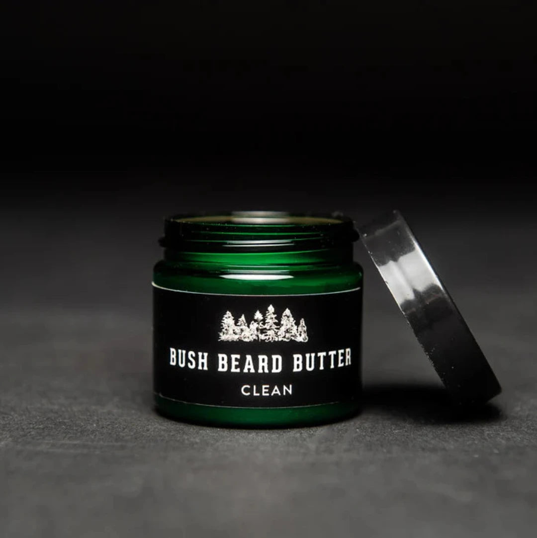 Clean Bush Beard Butter a moisturizing beard lotion in a green jar with black screw top lid.