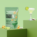 Eatable coconut lime margarita snack package with a cocktail on a green background