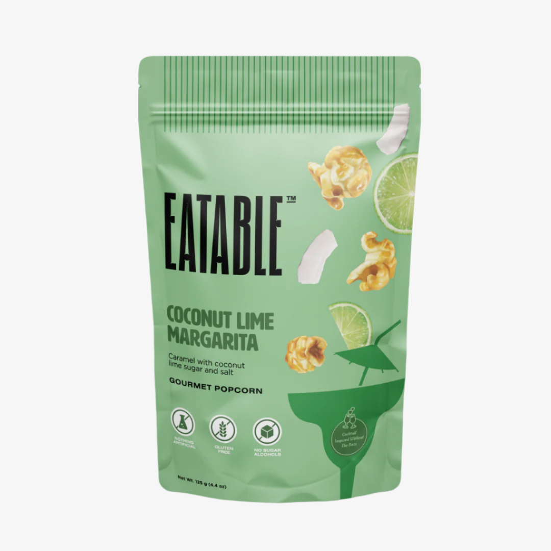 Eatable Coconut Lime Margarita popcorn bag on a green background