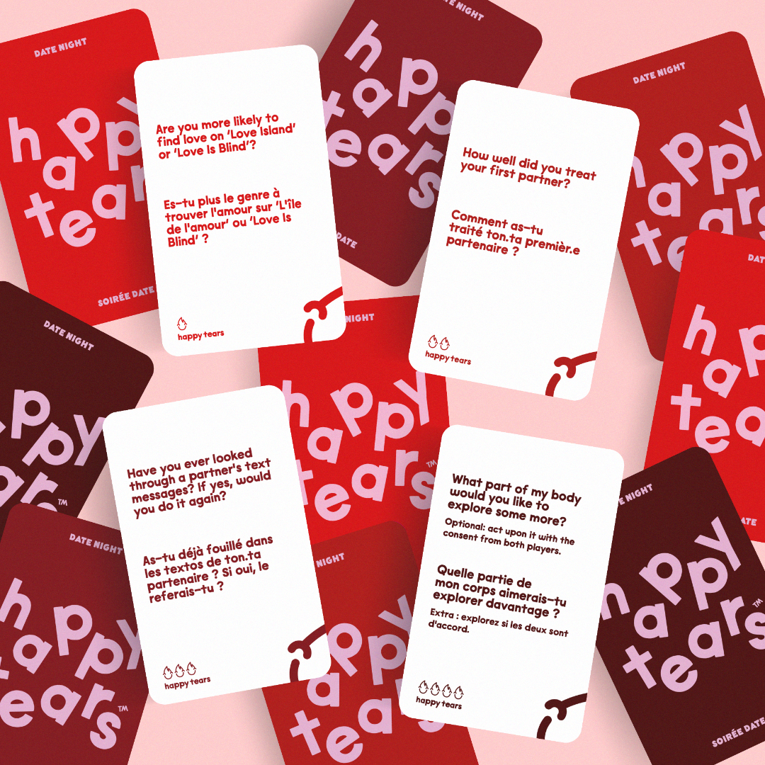 Happy Tears Intimate Connections card game, Ottawa. Red conversation cards in grey drawstring bag. 'Happy Tears' logo, bilingual text: 'For Intimate connections', 'Pour les connexions intimes'. Fun card game for couples.