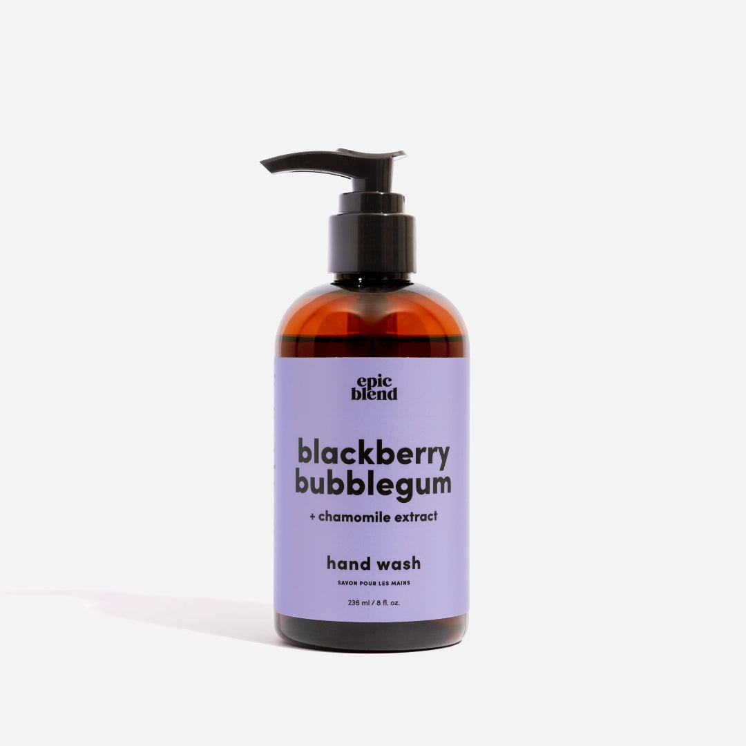 An amber plastic pump bottle of Epic Blend Blackberry Bubblegum Hand Wash with a light purple label. The label specifies "blackberry bubblegum + chamomile extract" and "hand wash".