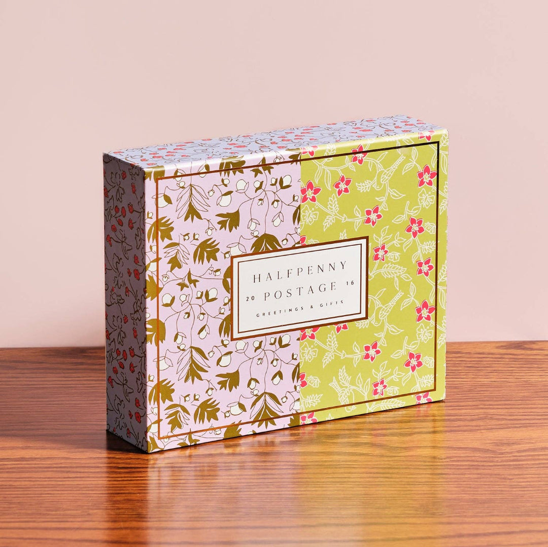 Decorative box with floral patterns on a wooden surface