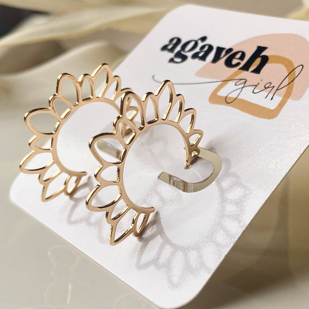 Gold sun-shaped earrings on a 'agaveh girl' branded card.