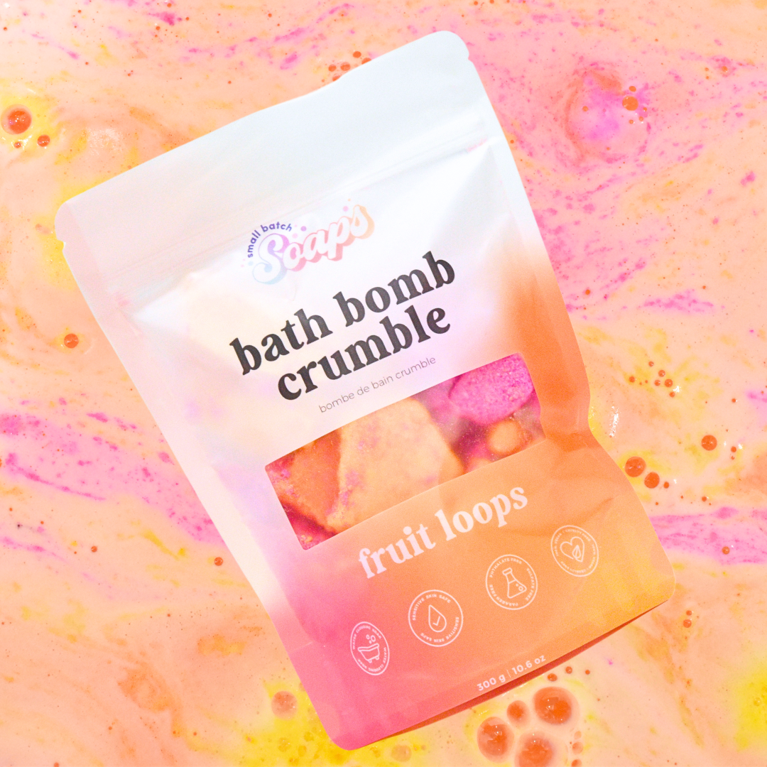 Packaged bath bomb crumble with 'fruit loops' text on a colorful background