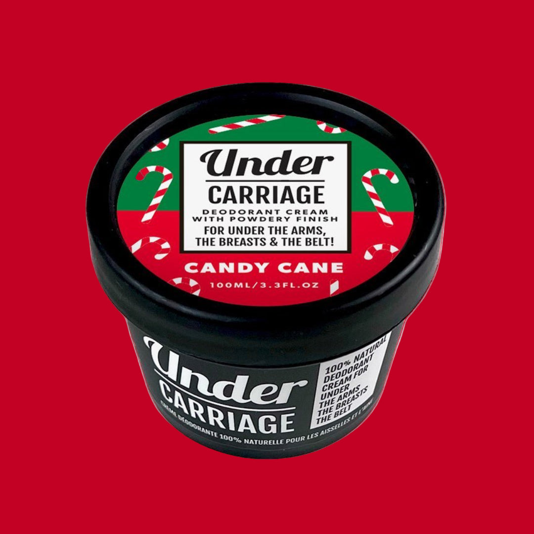 Deodorant cream container with candy cane design on a red background