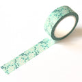Roll of decorative tape with a pattern on a white background