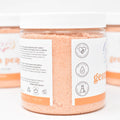 Three containers of 'Georgia Peaches' bath salts with visible labels on a white background.