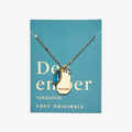 A gold necklace with a turquoise stone pendant. The pendant also has the word "FRIENDSHIP" engraved on it. The necklace is displayed on a blue card with the month "December" and the brand name "Foxy Originals."