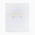 Gold star earrings on a 'Foxy Originals' branded card with text above.