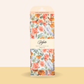 Floral-patterned packaging of Gold & Co. beeswax wraps on a beige background