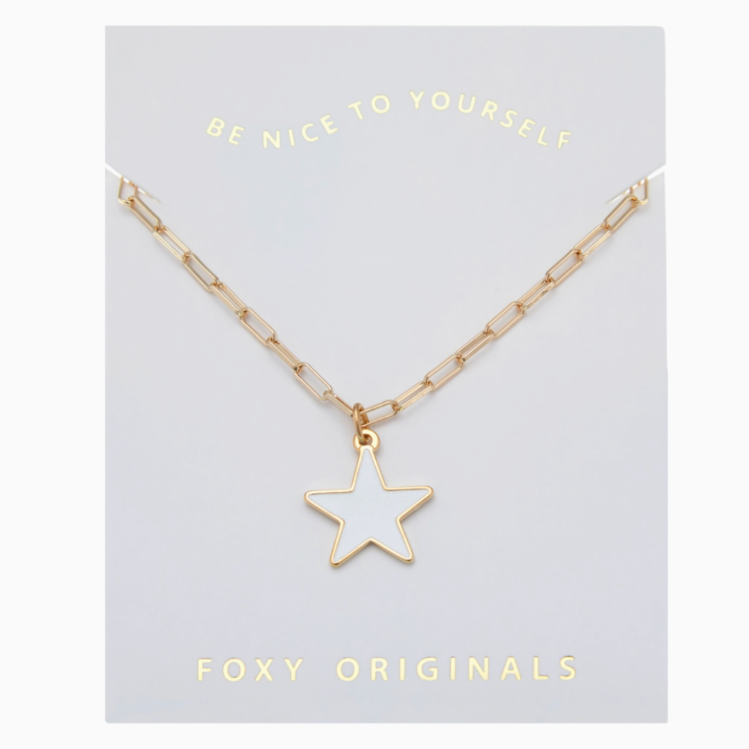 Gold star necklace on a 'Be Nice to Yourself' card with 'Foxy Originals' branding.