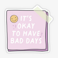 It's Okay To Have Bad Days Sticker, a white sticker with a purple post it reading "It's okay to have bad days"