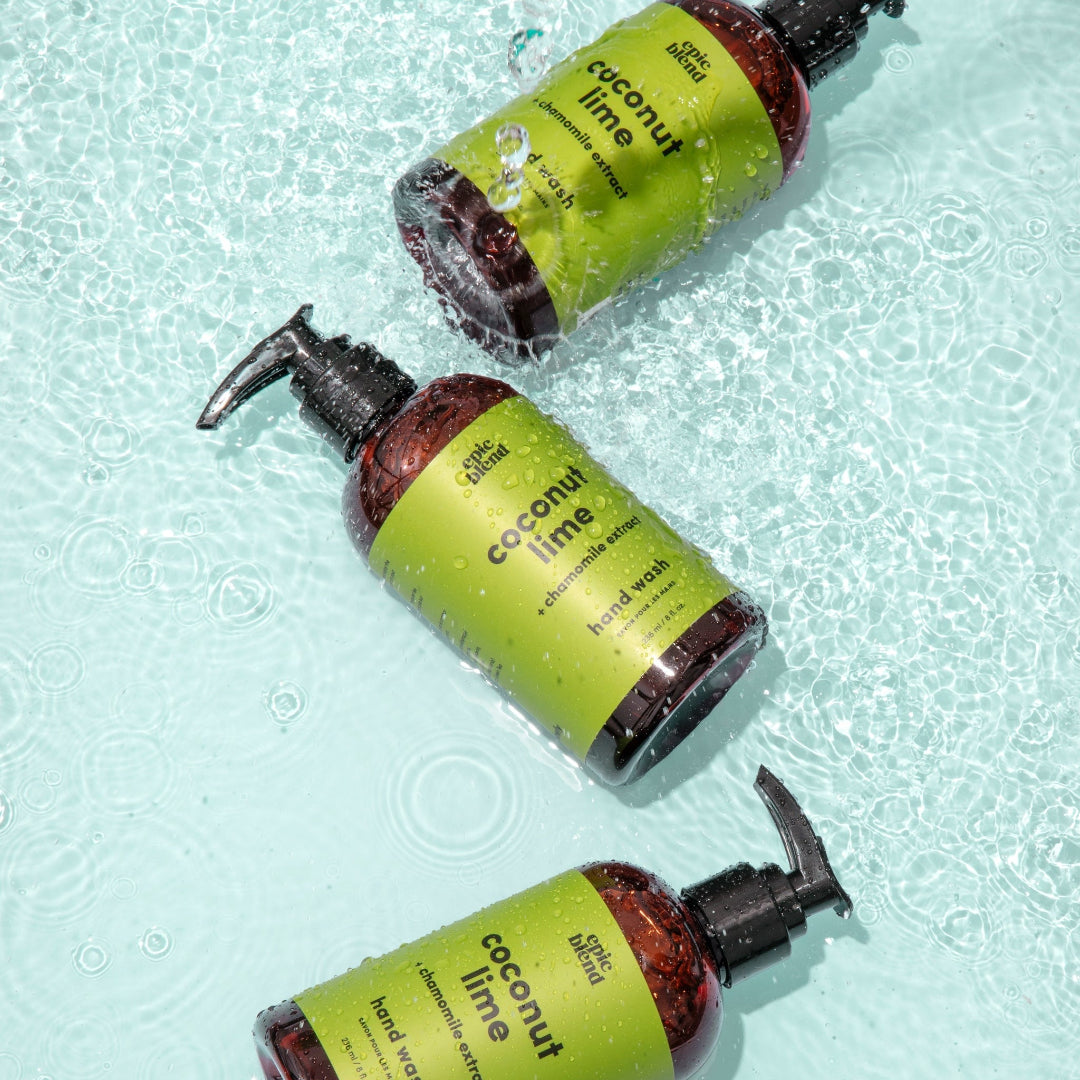 An amber plastic pump bottle of Epic Blend Coconut Lime Hand Wash with a lime green label. The label specifies "coconut lime + chamomile extract" and "hand wash".