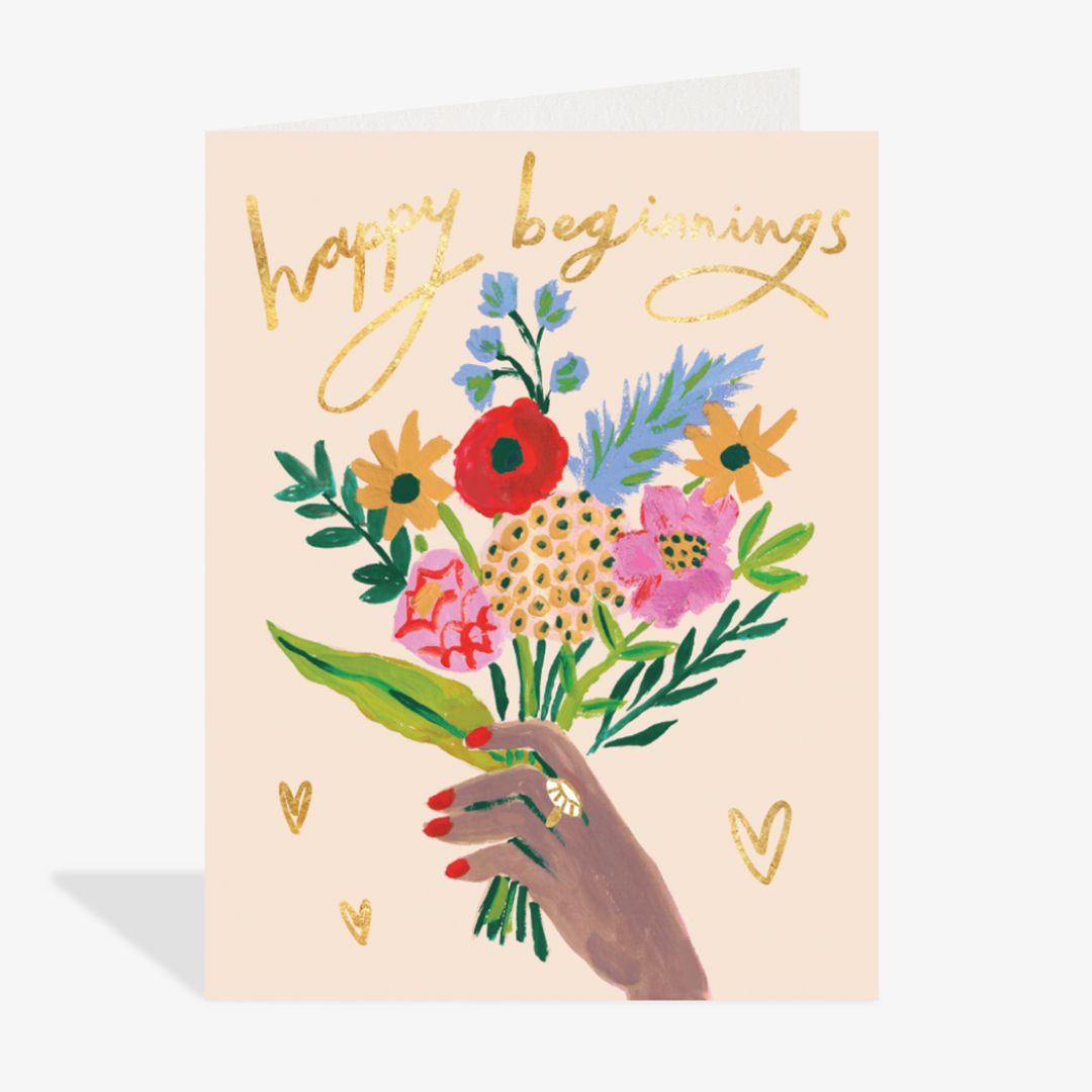 Greeting card with hand holding flowers and 'Happy Beginnings' text on a beige background