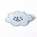 Smiley face cloud patch on a white background