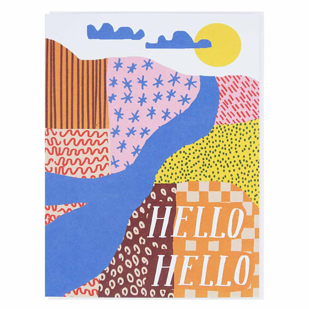 A colorful greeting card with a landscape design. The top features a yellow sun and blue clouds. Below that, various patterned sections in pink, red, orange, and yellow are separated by a blue wavy river. In the bottom right, the word "HELLO" is written twice in white over a checkered pattern.