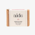 Bar of soap with 'aide' branding on a white background