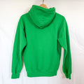 The back view of the same green Gildan hoodie, hanging on a wooden hanger against a white background. The back is plain.