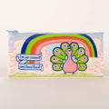 A rectangular light blue pencil case with a zipper, featuring a whimsical illustration of a pink peacock with an outstretched rainbow tail feathers. Above the peacock is a rainbow arc and a banner with the text "I'm so casual and laid back".