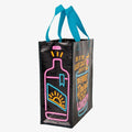 A black reusable tote bag with bright neon blue, pink, and yellow graphics. The front features a large cocktail glass with a cherry and straw, and text that reads "IS IT THE LAST CALL? OR IS IT THE FIRST DRINK OF THE REST OF OUR LIVES?!". On the left side, part of a neon bottle graphic is visible.