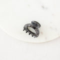Gray hair clip on a white background