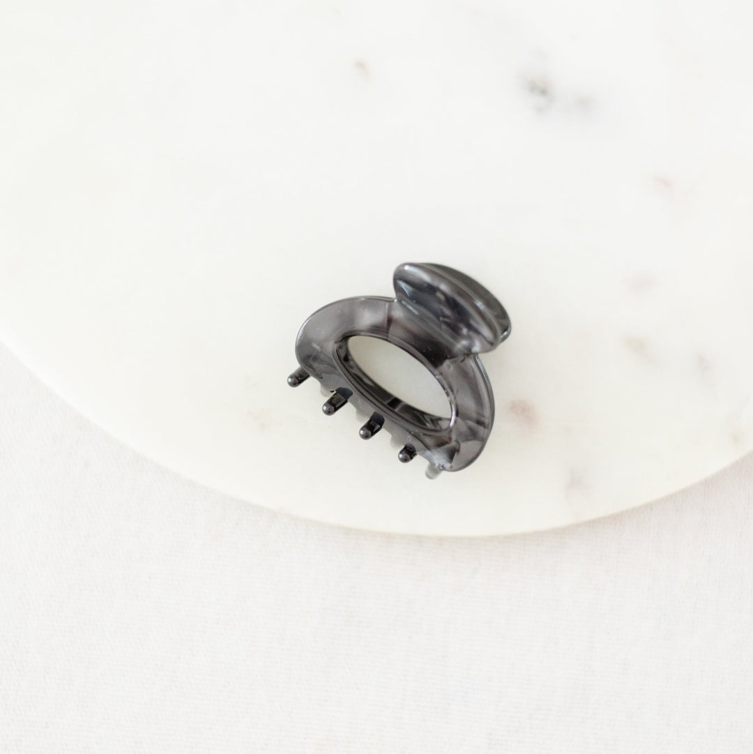 Gray hair clip on a white background