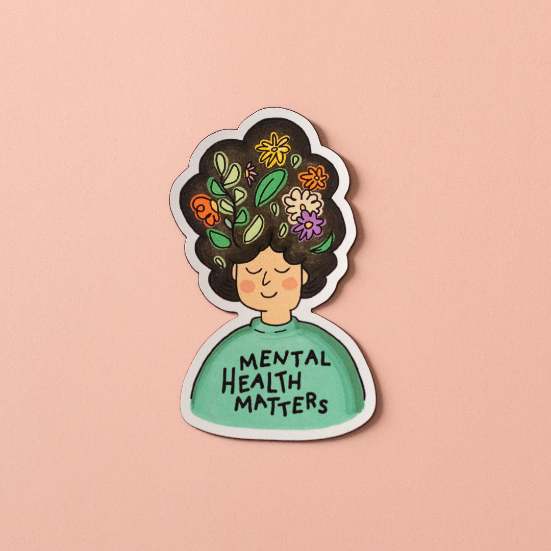 Mental Health Matters vinyl sticker is an illustration of a person with flowers in their big hair and the words "MENTAL HEALTH MATTERS" on their shirt.
