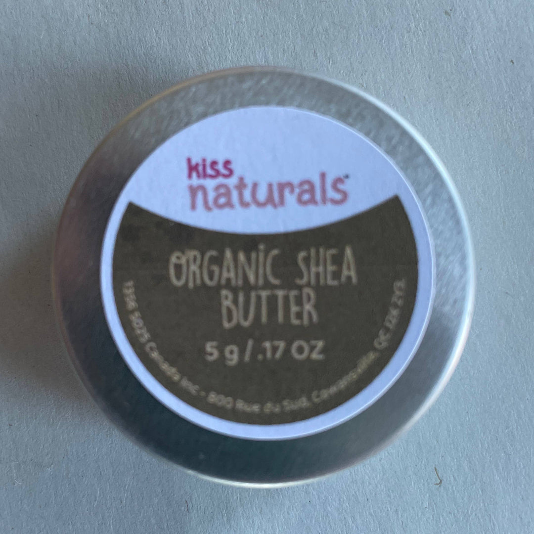Container of Kiss Naturals Organic Shea Butter on a light blue background