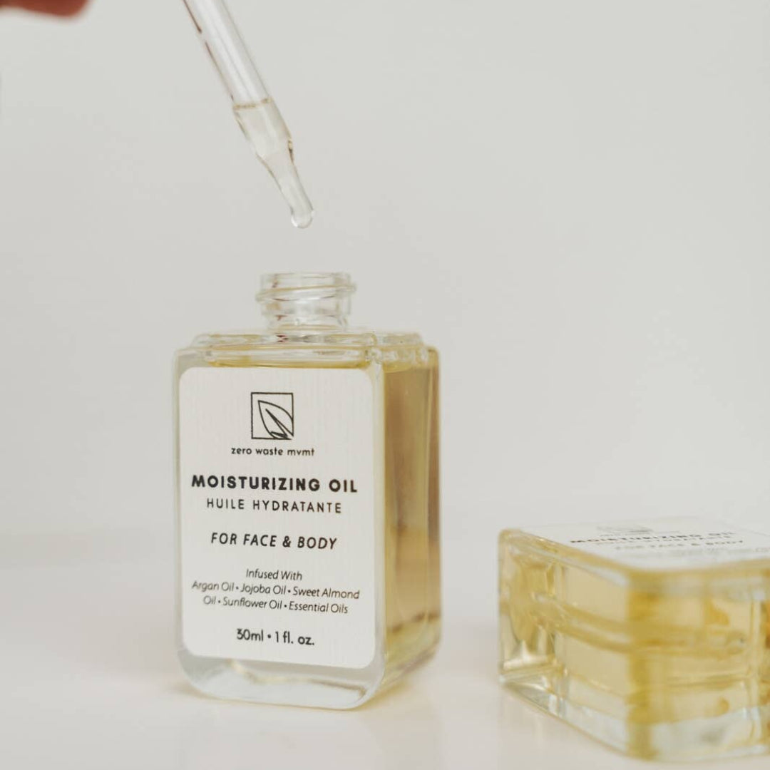 Moisturizing oil bottle with dropper on a light background