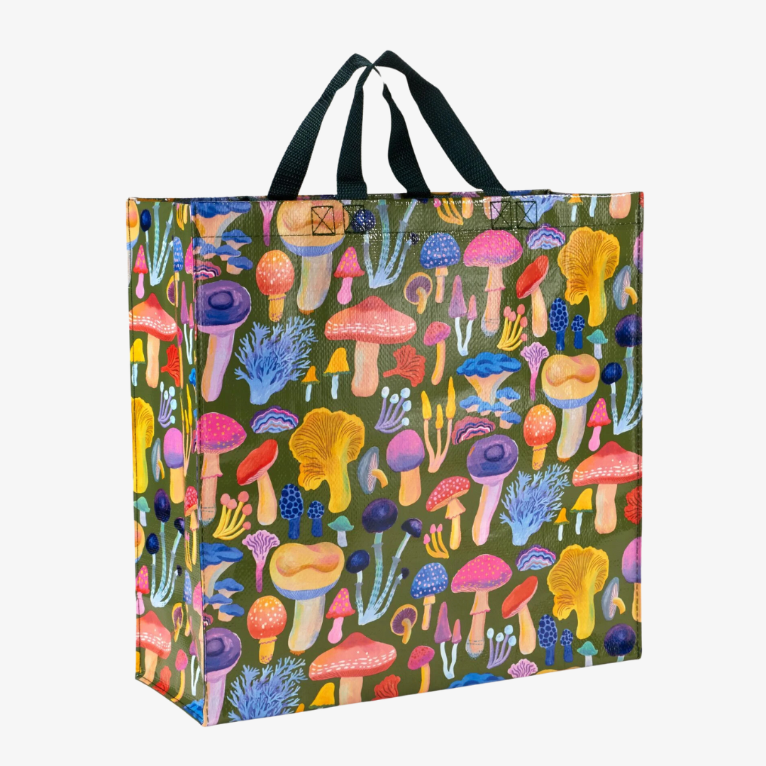 A reusable tote bag with a mushroom pattern. The bag is olive green with black handles. It is covered in a variety of colorful mushrooms in different shapes and sizes.