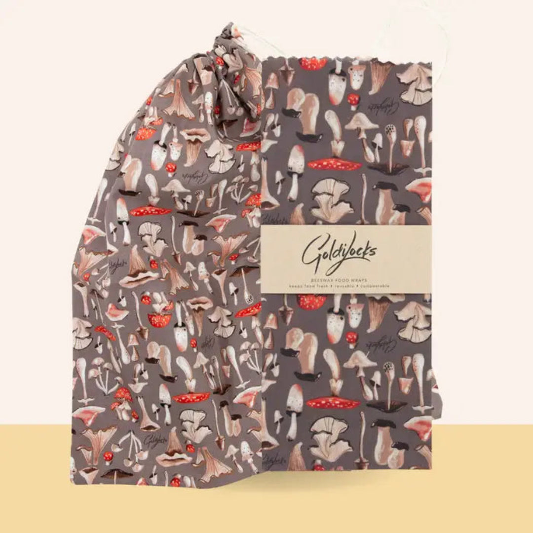 Patterned fabric with Goldylocks branding on a beige background