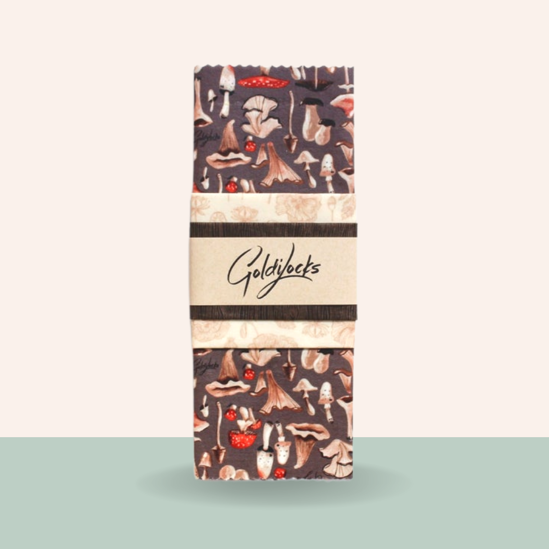 Pack of Goldylocks snacks with mushroom pattern on a light green background